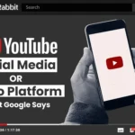 YouTube video thumbnail asking "Social Media OR Video Platform," showing a person holding a phone with the YouTube logo.