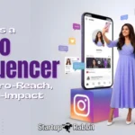 A woman in a blue dress stands by a giant phone and camera. Text reads: "What is a Nano Influencer" by Startup Rabbit.