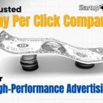 An image for Startup Rabbit, a "Trusted Pay Per Click Company," featuring a dollar bill balanced on stacks of coins.